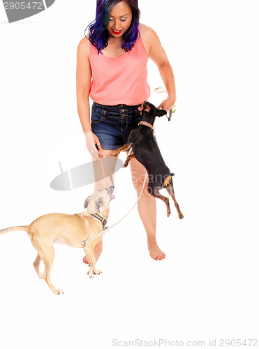 Image of Woman loving her dog's.