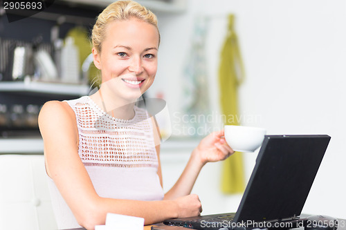 Image of Business woman working from home.