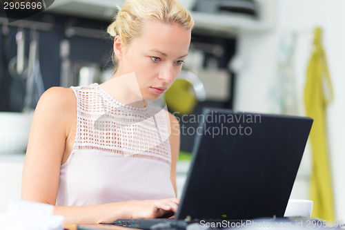 Image of Business woman working from home.