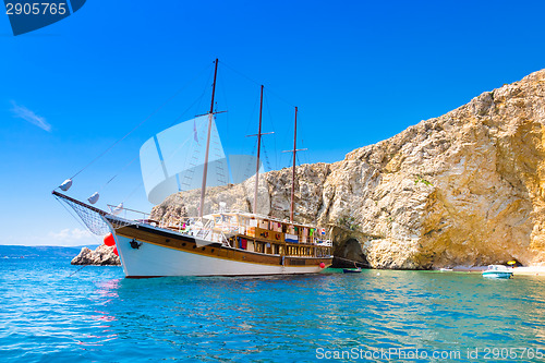 Image of Vintage sailing boat in bay.