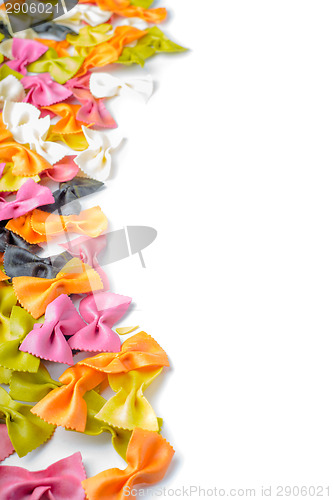 Image of Multicolored farfalle pasta,on the left edge