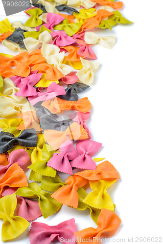 Image of Colored farfalle pasta, on the left edge