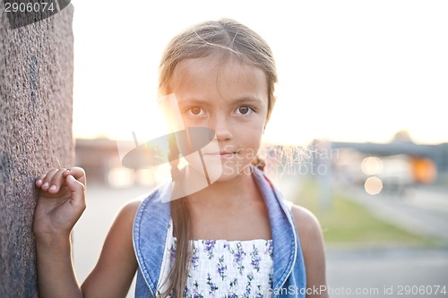 Image of Happy young girl in a city