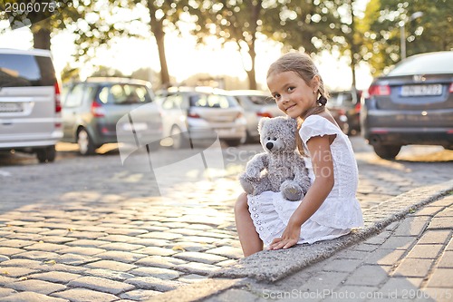 Image of Young lonely girl on a city street