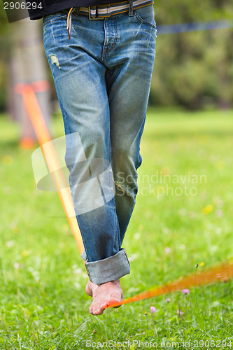 Image of Slack line in the city park.