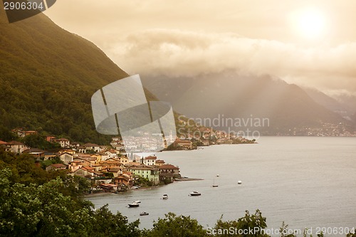 Image of View of italian village on Como lake in sunlight