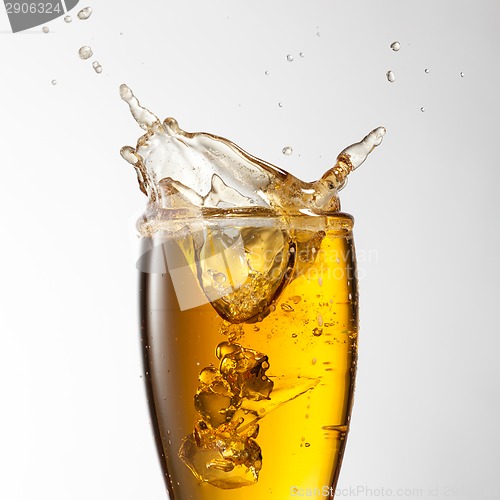 Image of Beer splash in glass isolated on white