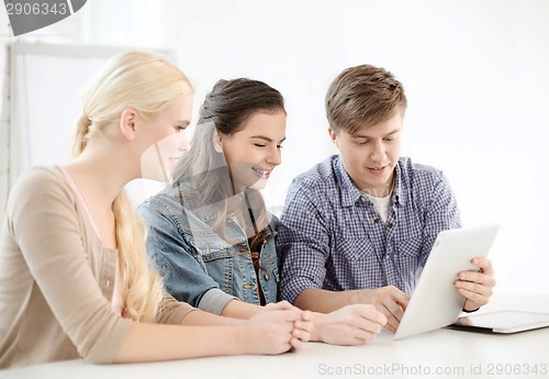 Image of smiling students with tablet pc computer at school