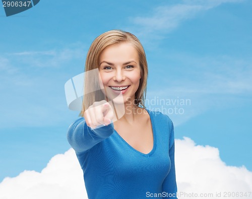 Image of smiling student pointing finger at you