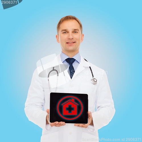 Image of smiling male doctor with tablet pc and stethoscope