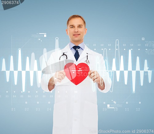 Image of smiling male doctor with red heart and stethoscope