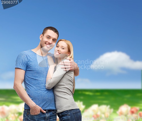 Image of smiling couple hugging