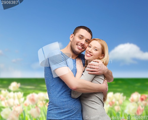 Image of smiling couple hugging