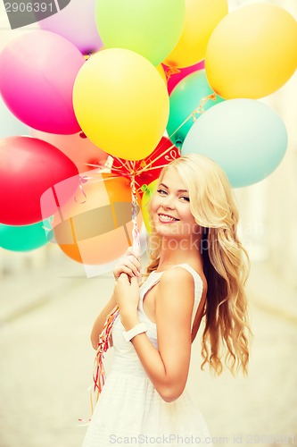 Image of woman with colorful balloons