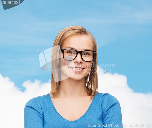 Image of smiling woman in eyeglasses