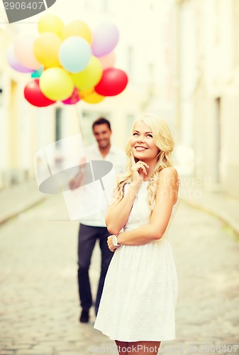 Image of couple with colorful balloons