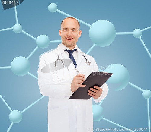 Image of smiling male doctor with clipboard and stethoscope