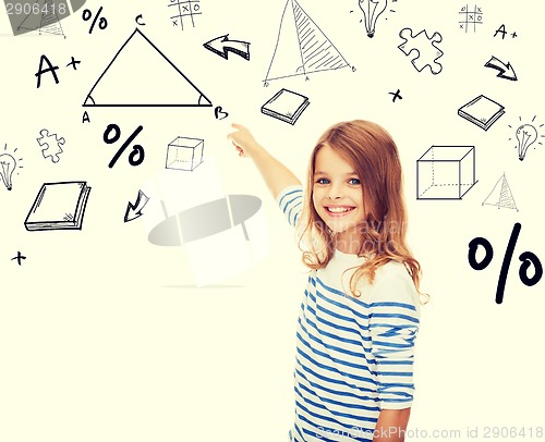 Image of girl pointing to triangle on virtual screen