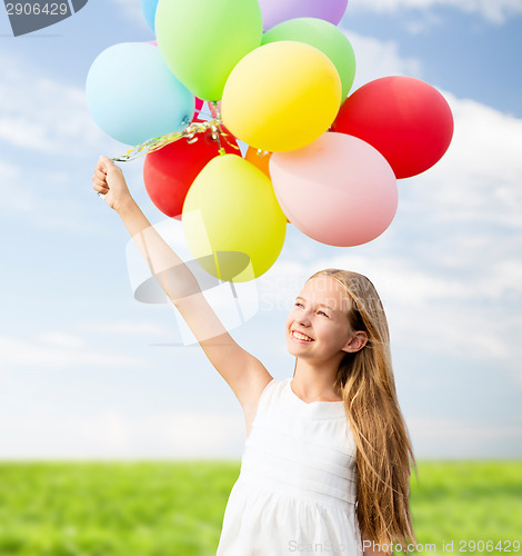 Image of happy girl with colorful balloons