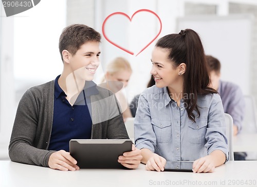 Image of students looking at tablet pc in lecture at school