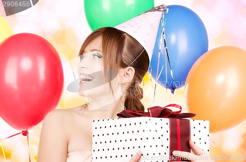 Image of party girl with balloons and gift box
