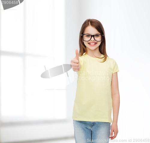 Image of smiling cute little girl in black eyeglasses