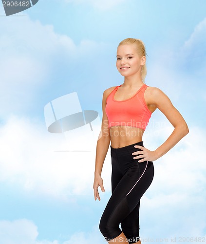 Image of beautiful athletic woman in sportswear