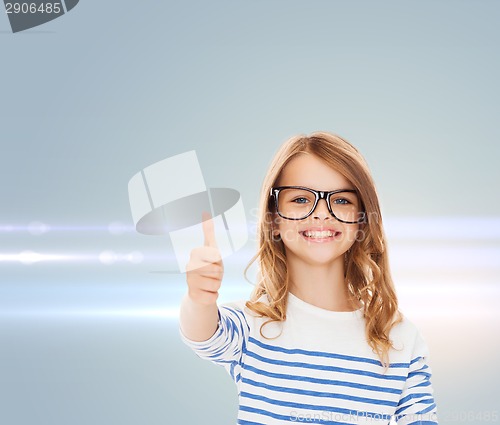 Image of little girl with black eyeglasses