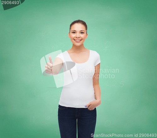 Image of smiling young woman in blank white t-shirt