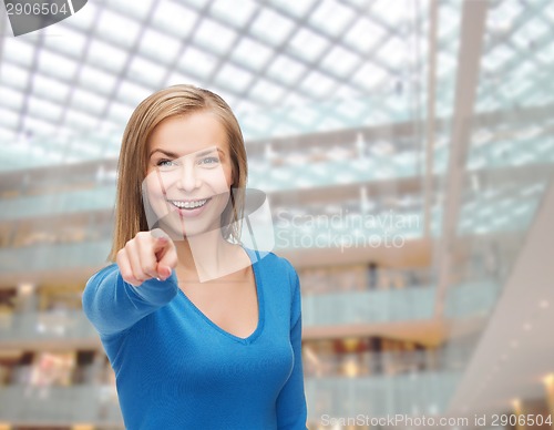 Image of smiling student pointing finger at you