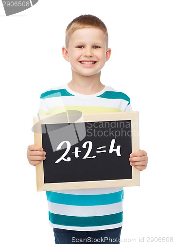 Image of smiling little boy with blank blackboard