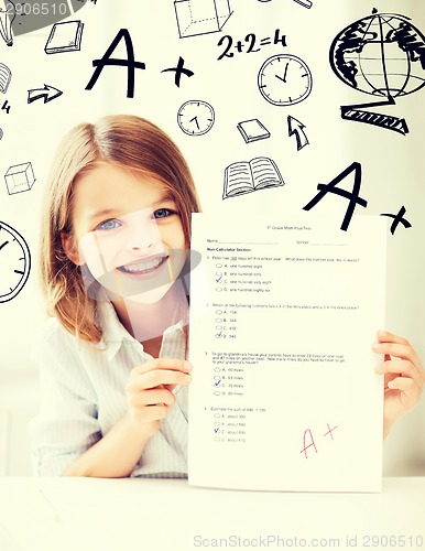 Image of girl with test and A grade at school