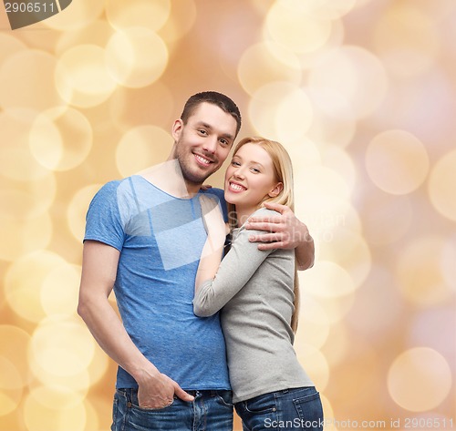 Image of smiling couple hugging