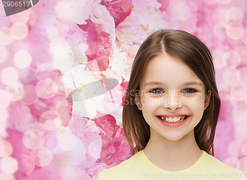 Image of smiling little girl over white background