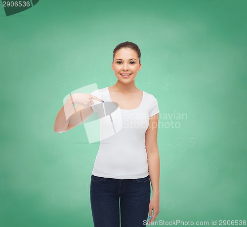 Image of smiling young woman in blank white t-shirt