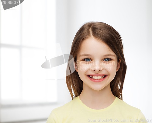 Image of smiling little girl over white background