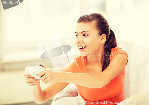 Image of woman with joystick playing video games