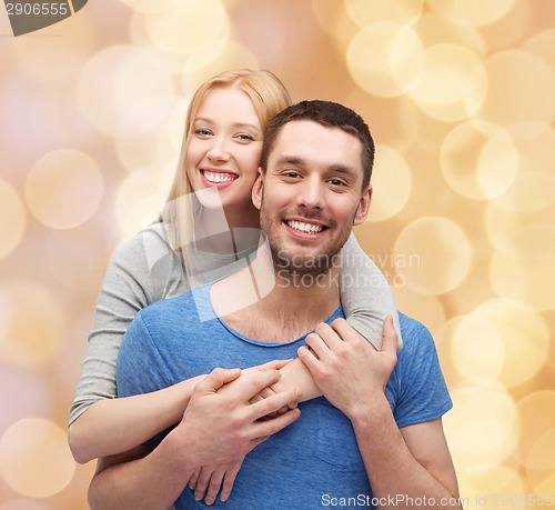 Image of smiling couple hugging
