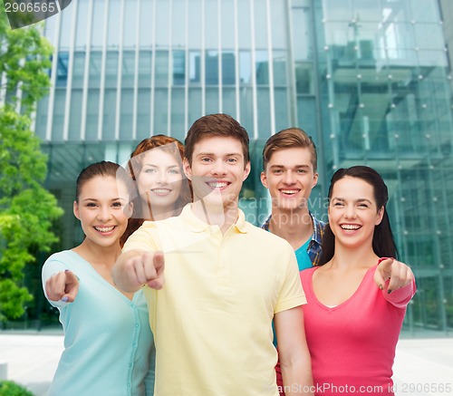 Image of group of smiling teenagers over city background