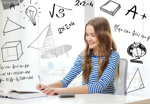 Image of student girl with book, notebook and calculator