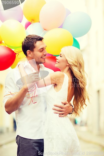 Image of couple with colorful balloons