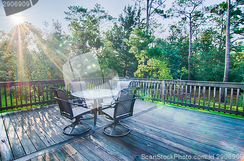 Image of beach house porch at sunrise