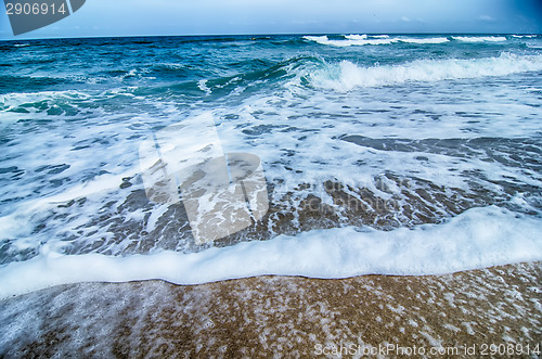 Image of seascape with waves and sand beach