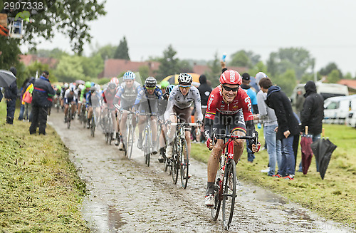 Image of The Cyclist Lars Bak on a Cobbled Road - Tour de France 2014