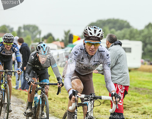 Image of The Cyclist Richie Porte on a Cobbled Road - Tour de France 2014