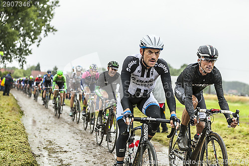 Image of The Peloton on a Cobbled Road- Tour de France 2014