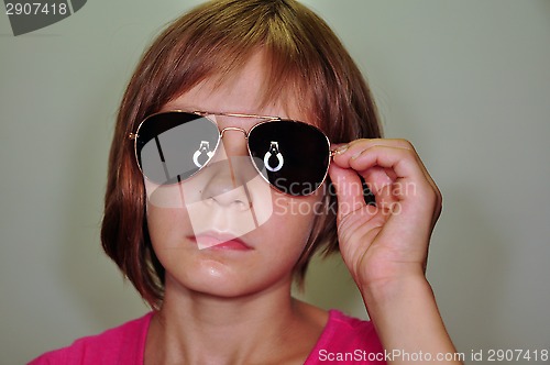 Image of child wearing sunglasses