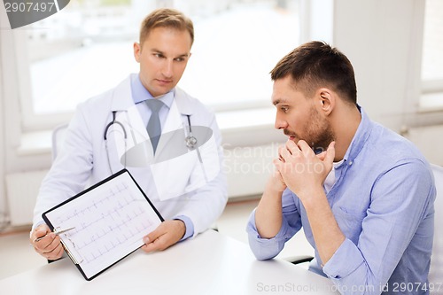 Image of doctor with clipboard and patient in hospital