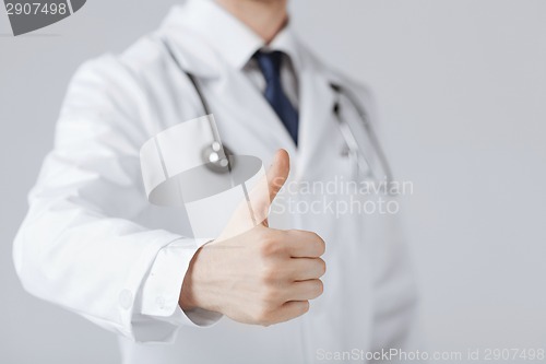 Image of male doctor hand showing thumbs up