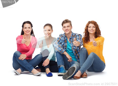 Image of group of smiling teenagers showing thumbs up